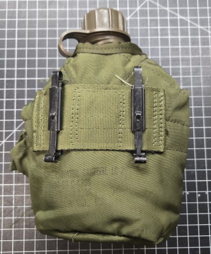 olive drab nylon canteen cover dated 1988, and plastic canteen 1996
