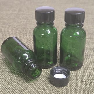 Bottle, Boston Round, Green Glass with Black Cap 2-5/8"